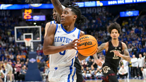 Mar 15, 2024; Nashville, TN, USA; Kentucky Wildcats guard Rob Dillingham (0) drives past Texas A&M Aggies guard Manny Obaseki (35) during the second half at Bridgestone Arena. Mandatory Credit: Steve Roberts-USA TODAY Sports